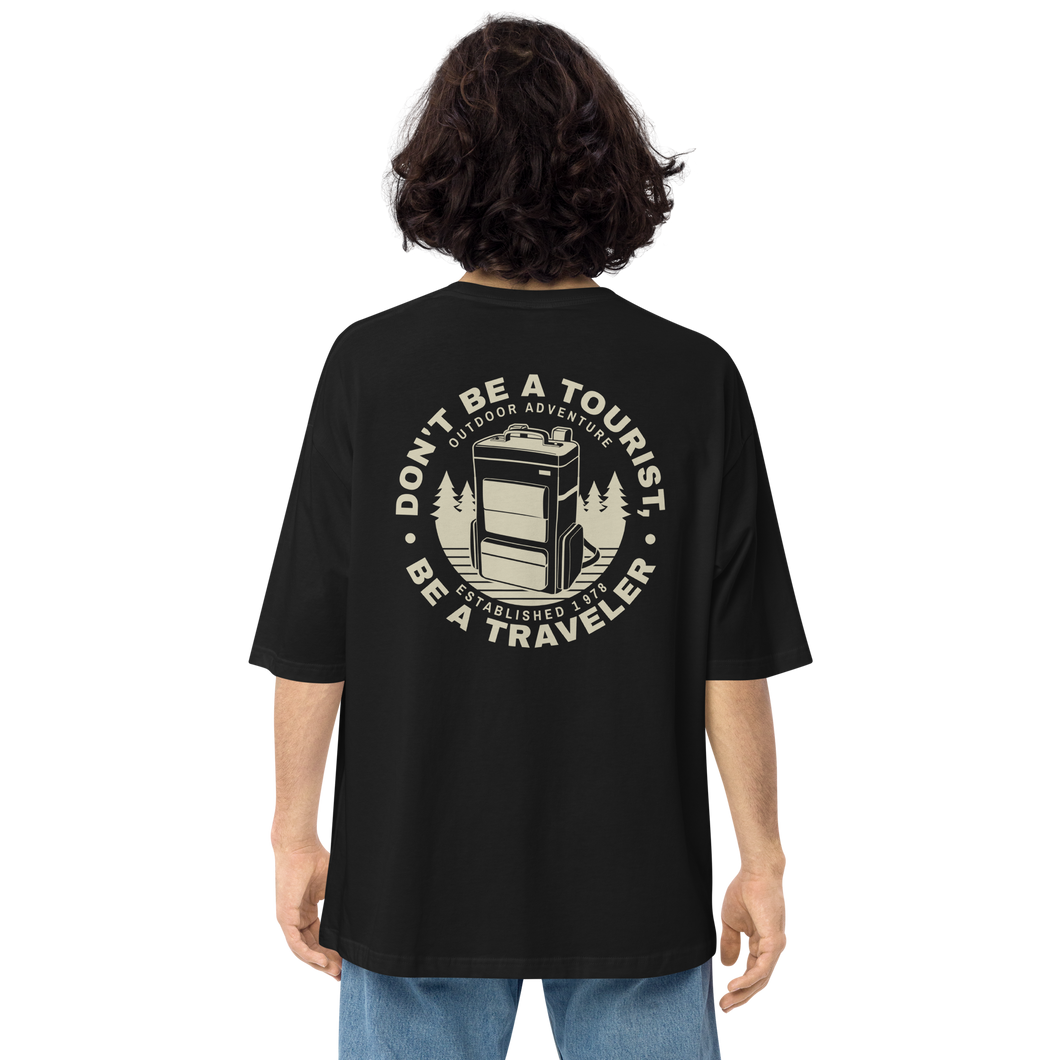 Black / S Don't Be Tourist, Be A Traveller Back Unisex Oversized T-Shirt by Design Express