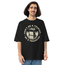 Black / S Don't Be Tourist, Be A Traveller Front Unisex Oversized T-Shirt by Design Express